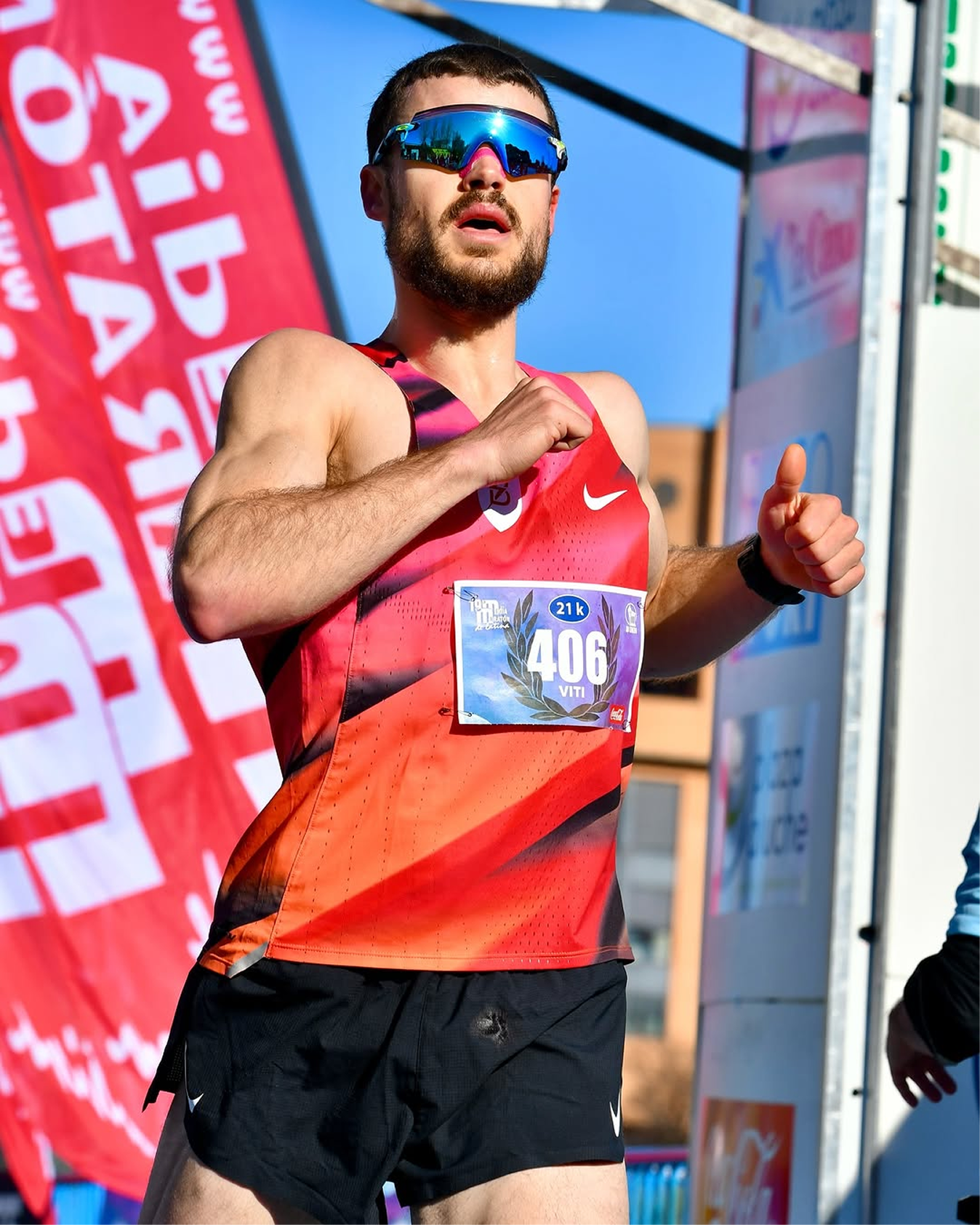 Strength runner wearing HiStrips nasal strip in dark gym — power meets endurance