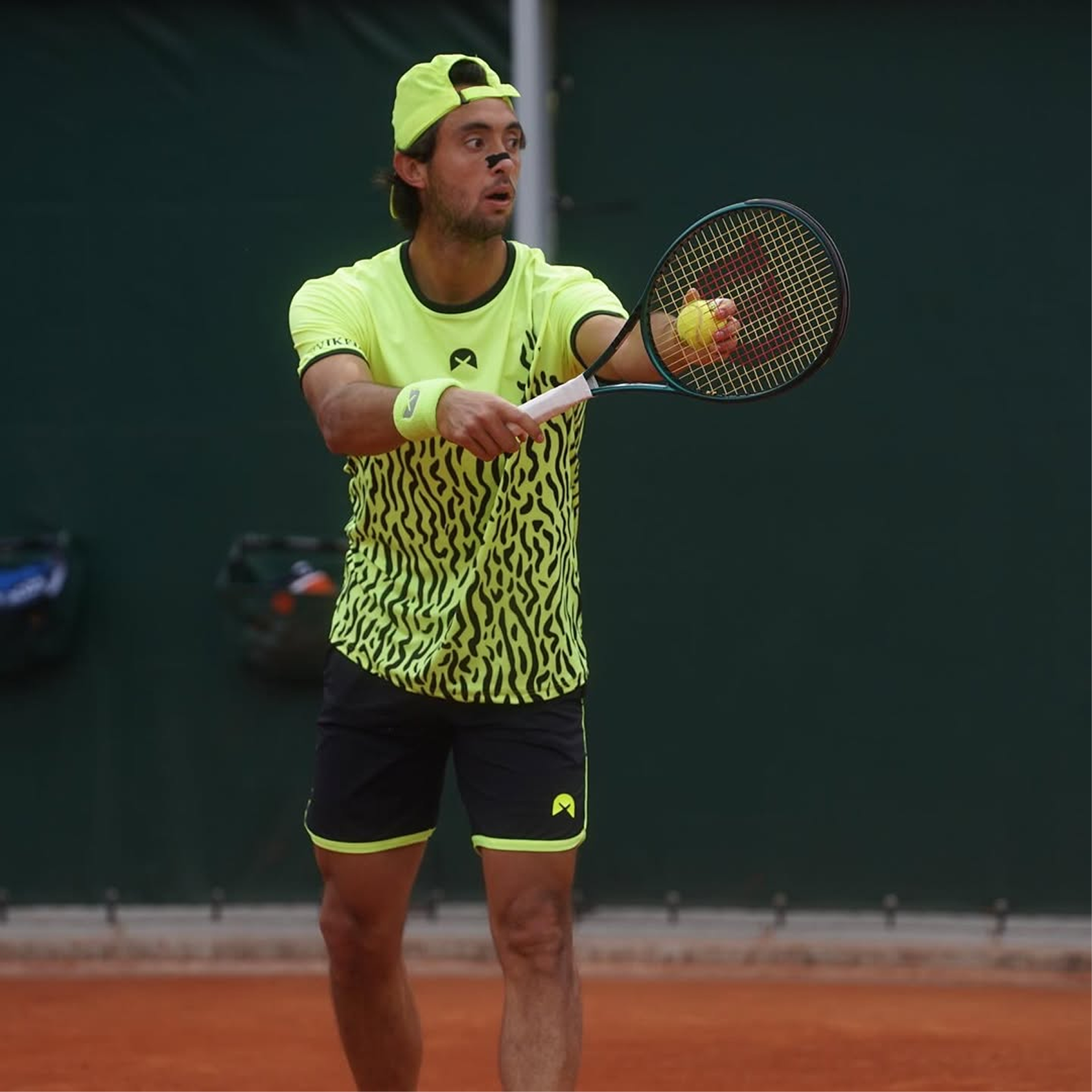 Tennis player wearing HiStrips nasal strip during match — nasal breathing performance edge