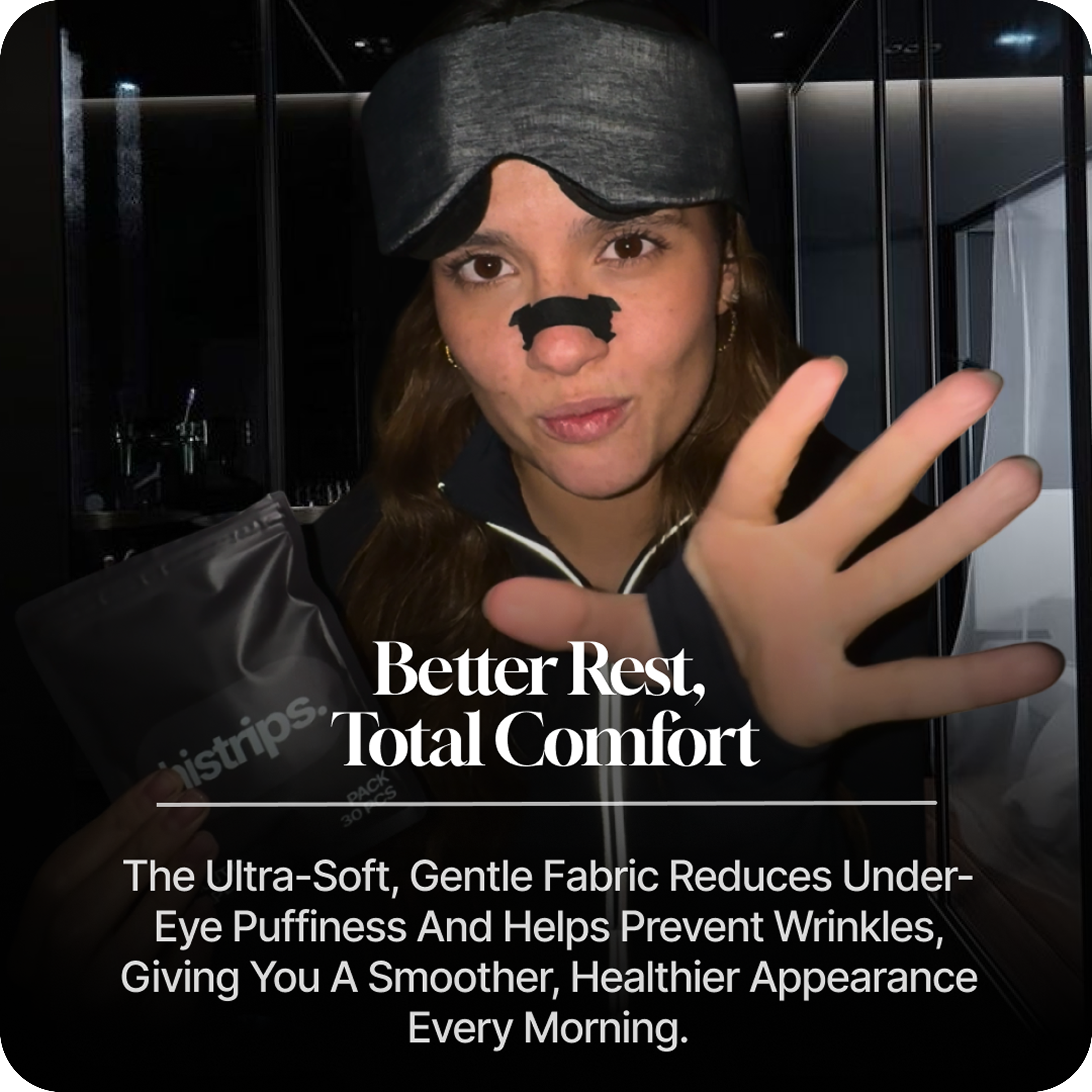 Luxury black Eclipse sleep mask on white pillow